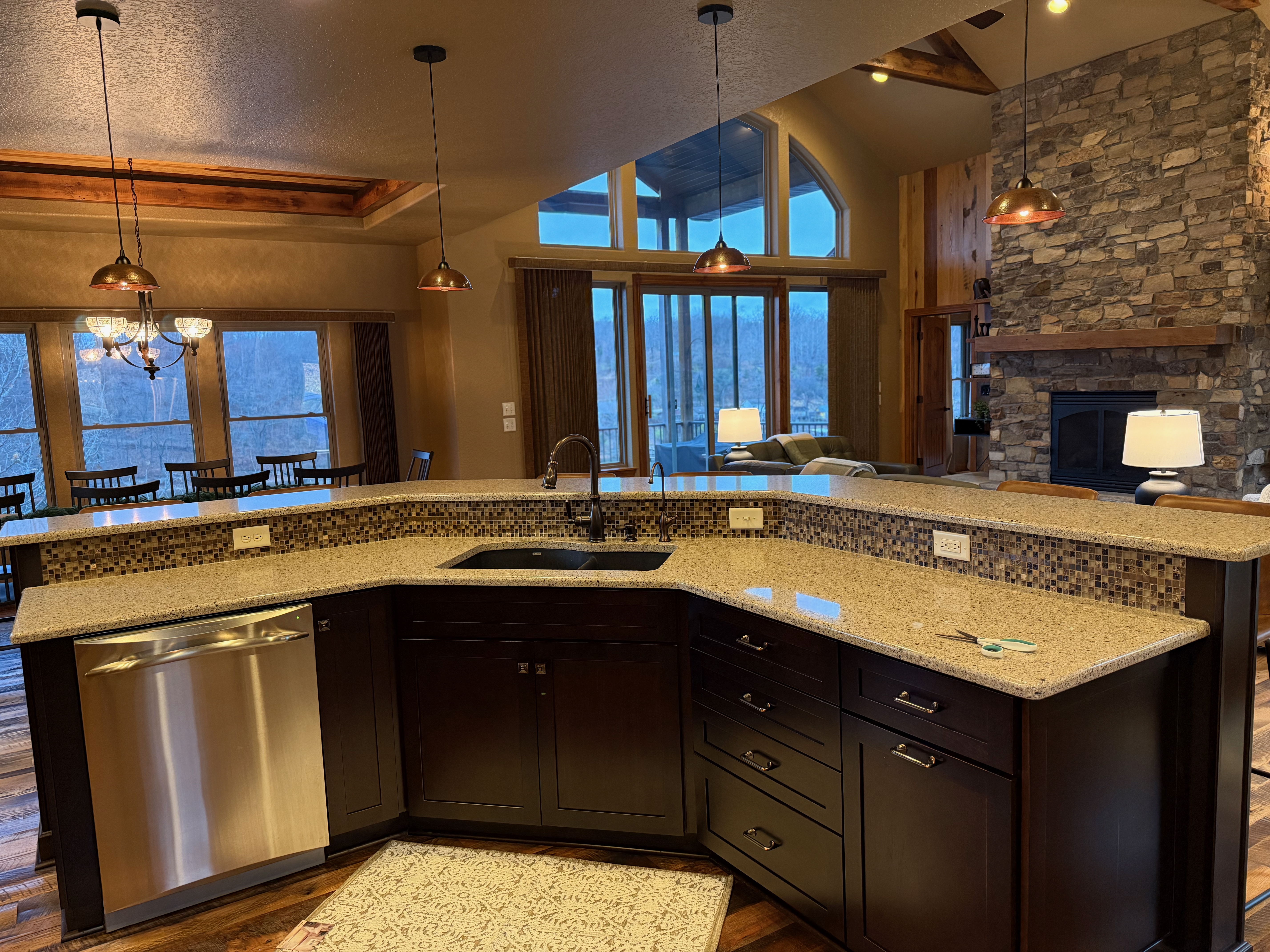 Chef-ready kitchen with granite counters and pendant lights