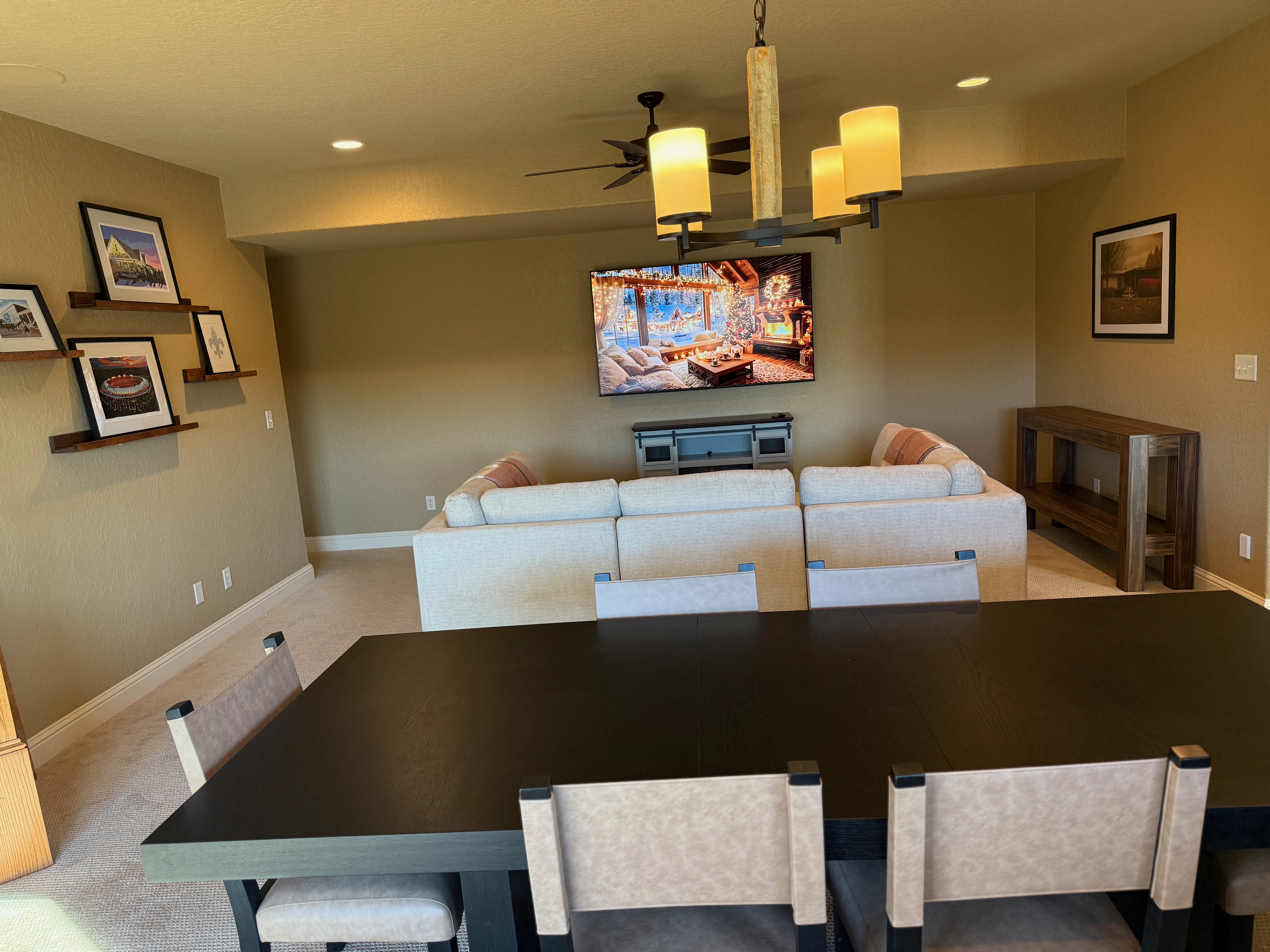 Middle level entertainment area with game table and large TV